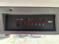 Control panel of a 1999 Freightliner FL80 featuring multiple switches for various functions including lights and electrical systems