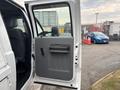 A 2014 Ford F-550 door partially open showing a gray interior panel and handle