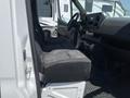 Interior view of a 2022 Mercedes-Benz Sprinter showing the driver's seat and dashboard with a focus on the front cabin design and features