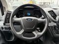 2019 Ford Transit steering wheel with a central Ford emblem and dashboard display showing vehicle information