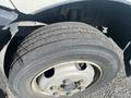 A close-up of a tire from a 2019 Hino 195 showing the tread pattern and wheel rim details