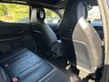 Interior view of the rear seats of a 2023 Fisker Ocean featuring leather upholstery and a sleek design