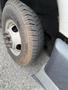 Close-up of a tire on a 2017 Chevrolet Express showing tread pattern and wheel rim details