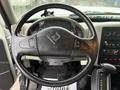 The steering wheel of a 2014 International TerraStar with controls for audio and cruise settings visible in the center