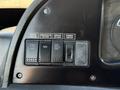 Control panel featuring buttons for driver heater windshield de-icer mirror de-icer and dimmer switch