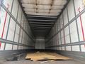 A 2010 Great Dane 45-foot trailer with a bare interior and a piece of plywood on the floor