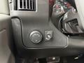 Dashboard controls of a 2020 Chevrolet Express including a headlight control dial and a dome light switch