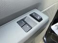 Close-up of the power window control panel from a 2011 Ford Econoline featuring buttons for window operation including an auto function