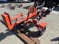 A red 2021 Wallenstein Wx540-0RA tow-behind industrial log splitter with a gas engine and wheels for mobility