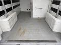 Interior of a 2020 RAM Promaster with a spacious cargo area featuring a flat rubber floor and metal trim