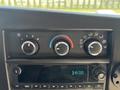 Dashboard controls of a 2020 Chevrolet Express displaying climate settings and a digital clock reading 14:30
