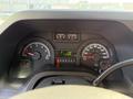 Dashboard of a 2012 Ford Econoline E-450 showing gauges for speed, fuel, and temperature along with mileage display