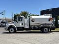 A white 2008 International DuraStar truck with a water tank labeled potable water only and various logos on the side
