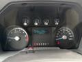 Instrument cluster of a 2011 Ford F-250 SD displaying speedometer fuel gauge and various warning indicators
