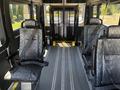 Interior of a 2016 RAM Promaster with dark patterned seats and safety straps visible on the floor and walls