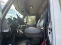 Interior view of a 2008 International 4400 with a driver's seat and dashboard visible showcasing various controls and instruments