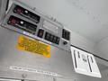 2012 Ford Econoline E-450 dashboard with control switches and buttons for emergency lights and other functions