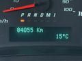 Display panel of a 2015 GMC Savana showing a mileage of 84055 kilometers and a temperature reading of 15 degrees Celsius