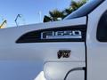 Close-up of a 2017 Ford F-650 Super Duty emblem showing the model name and "Triton V10" badge