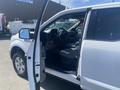 A 2019 Ford F-150 with an open driver's door showcasing the interior and steering wheel