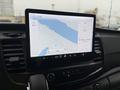 A 2023 Ford Transit dashboard display showing a navigation map and audio settings