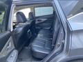 Interior view of a 2017 Nissan Murano showing the rear seats and door panel with leather upholstery and a clean design