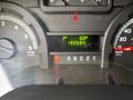 The dashboard of a 2013 Ford E-350 Super Duty displaying the trip meter and odometer readouts with various gauges and indicators