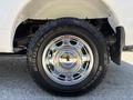 A 2019 Ford F-150 with a shiny chrome wheel and a rugged tire with the brand name Ridge Grappler AT visible