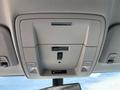 Ceiling console of a 2020 Chevrolet Silverado featuring controls for lights and the vehicle's sunroof