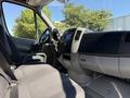 Interior view of a 2017 Mercedes-Benz Sprinter highlighting the driver's seat steering wheel and dashboard controls
