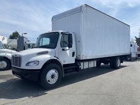 A white 2017 Freightliner M2 106 box truck with a large cargo area and multiple wheels parked in a lot