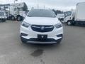 A white 2018 Buick Encore positioned facing forward with a sleek design and distinctive front grille