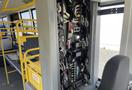 A 2017 Grande West Vicinity bus interior showing an assortment of electrical wires and control panels on the side wall