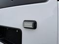 A close-up of an LED light on the side of a 2016 GMC Savana van