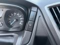 Dashboard of a 2016 Ford Transit 150 showing the speedometer and control buttons with a focus on the button for the windshield wipers