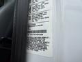 A 2019 Ford F-750 with a vehicle information label detailing specifications and compliance standards