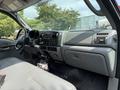 Interior view of a 2007 Ford F-450 showing the dashboard controls seats and gear shift