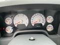 The dashboard of a 2006 Dodge Ram 2500 displaying gauges for RPM speed fuel and temperature with an odometer reading of 80599
