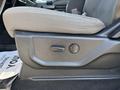 Close-up of the seat adjustment control on a 2019 Ford F-150 featuring a fabric seat with detailed stitching and ergonomic design