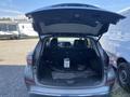 A 2017 Nissan Murano with its rear hatch open displaying the spacious cargo area and rear seats folded down