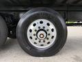 Close-up of a 2019 Ford F-750 wheel featuring a chrome hub with multiple bolt holes and a black Continental tire labeled HSR2