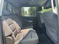 Interior view of a 2017 Chevrolet Silverado 1500 showing the rear seating area with two rows of seats in gray fabric