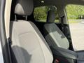 Two front seats of a 2020 Ford Escape with light gray fabric upholstery and adjustable headrests
