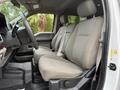 Interior of a 2019 Ford F-350 SD showing the front passenger and driver seats with gray fabric upholstery and a steering wheel