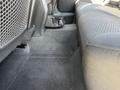 Interior shot of the back seat area of a 2006 Pontiac G6 featuring a gray seat and fabric texture with a floor area that appears clean and empty