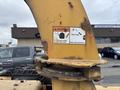 A close-up of the warning label on a 2015 Vermeer Corporation BC1200XL with cautionary instructions regarding chip debris and eye protection