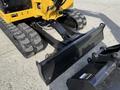 A 2022 Caterpillar 306 excavator with rubber tracks and an attached bucket in the foreground