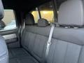 Interior view of the backseat of a 2014 Ford F-150 with black fabric upholstery and three headrests