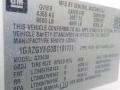 2011 Chevrolet Express with a vehicle information label detailing specifications and safety standards for the bus model