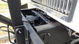 The image shows the front section of a 2003 International 5600i truck highlighting the engine and chassis components along with the distinctive grille design